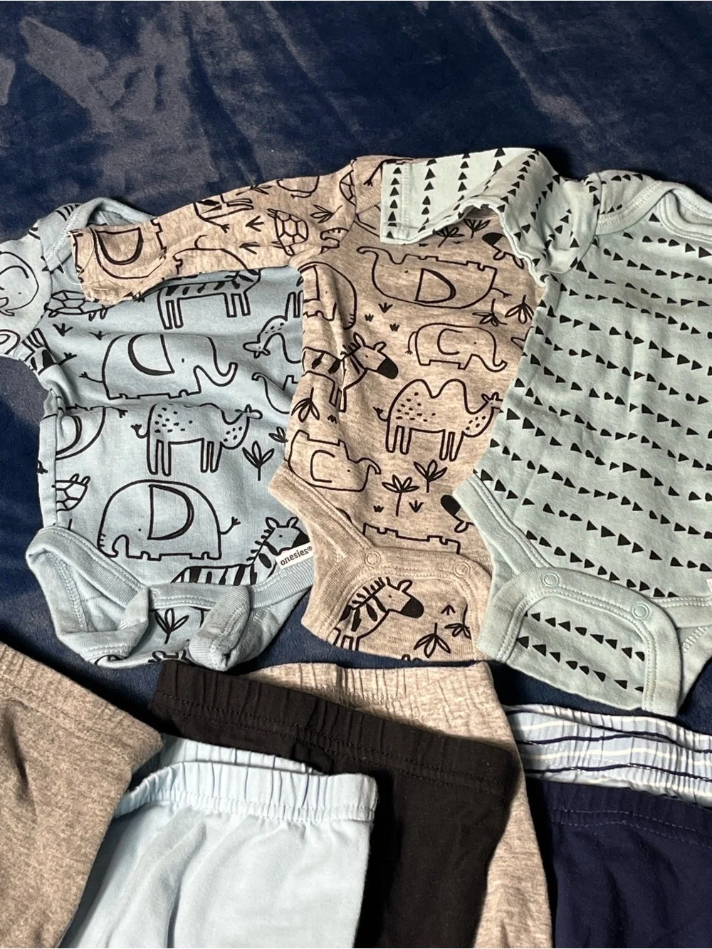 Newborn shirts and pants  9 pc bundle.  3 tops & 6 footed pants